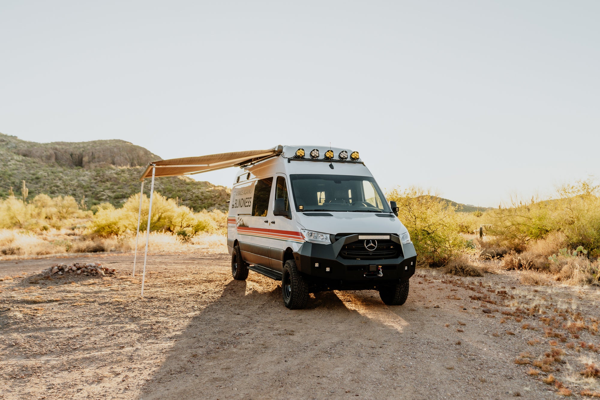 27North Adventure Van in the desert with the awning out at sunset