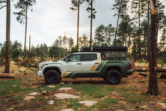 Overland Tundra parked in a forest