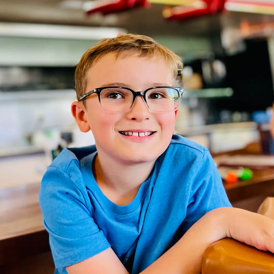 Luke sitting at a diner smiling