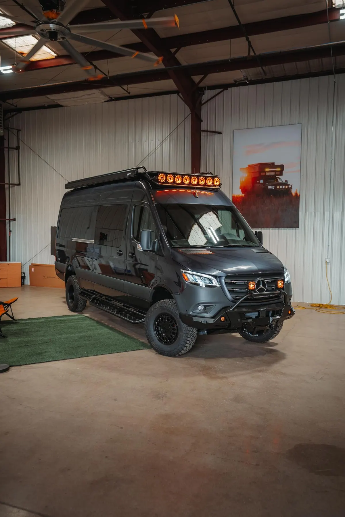 The Tenorite Gray Mercedes-Benz Sprinter 170 with roof rack, lift and KC HiLiTES lighting, ready for its custom build