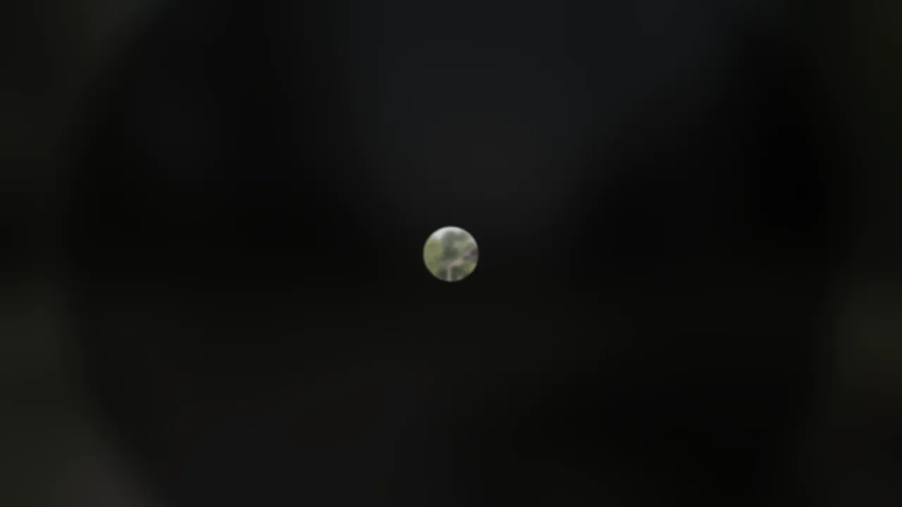 A small clear center in dark.