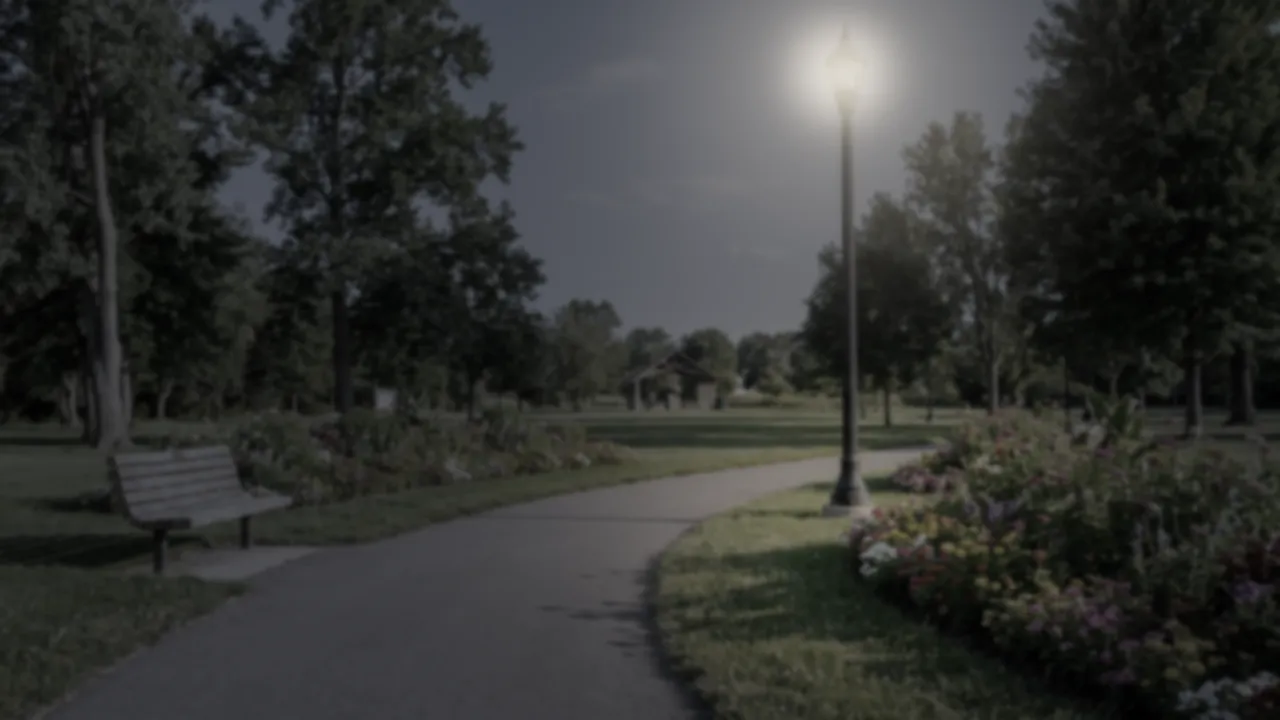 The park at dusk with the lamp lit: softer and more comfortable than the daylight view.