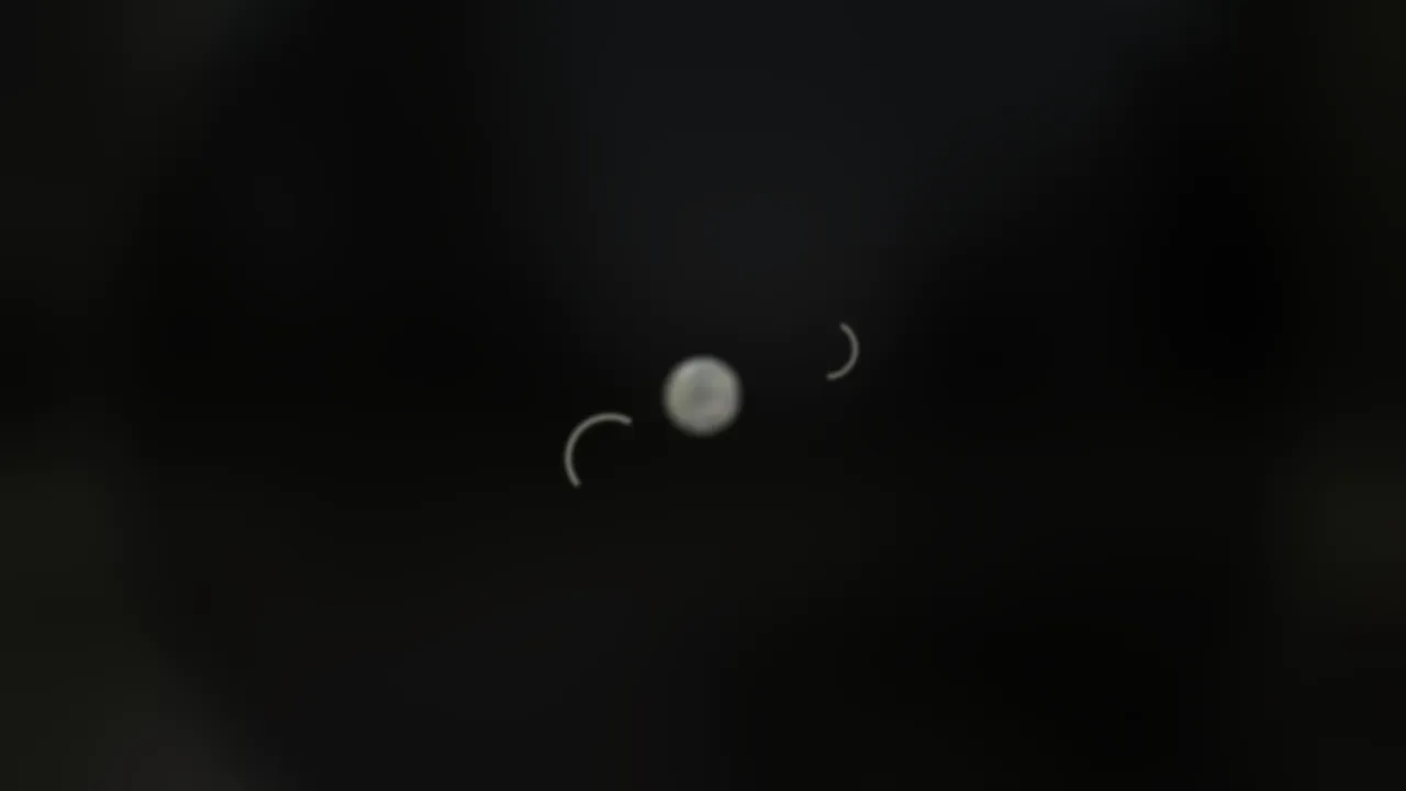 A faint spot of light in dark.